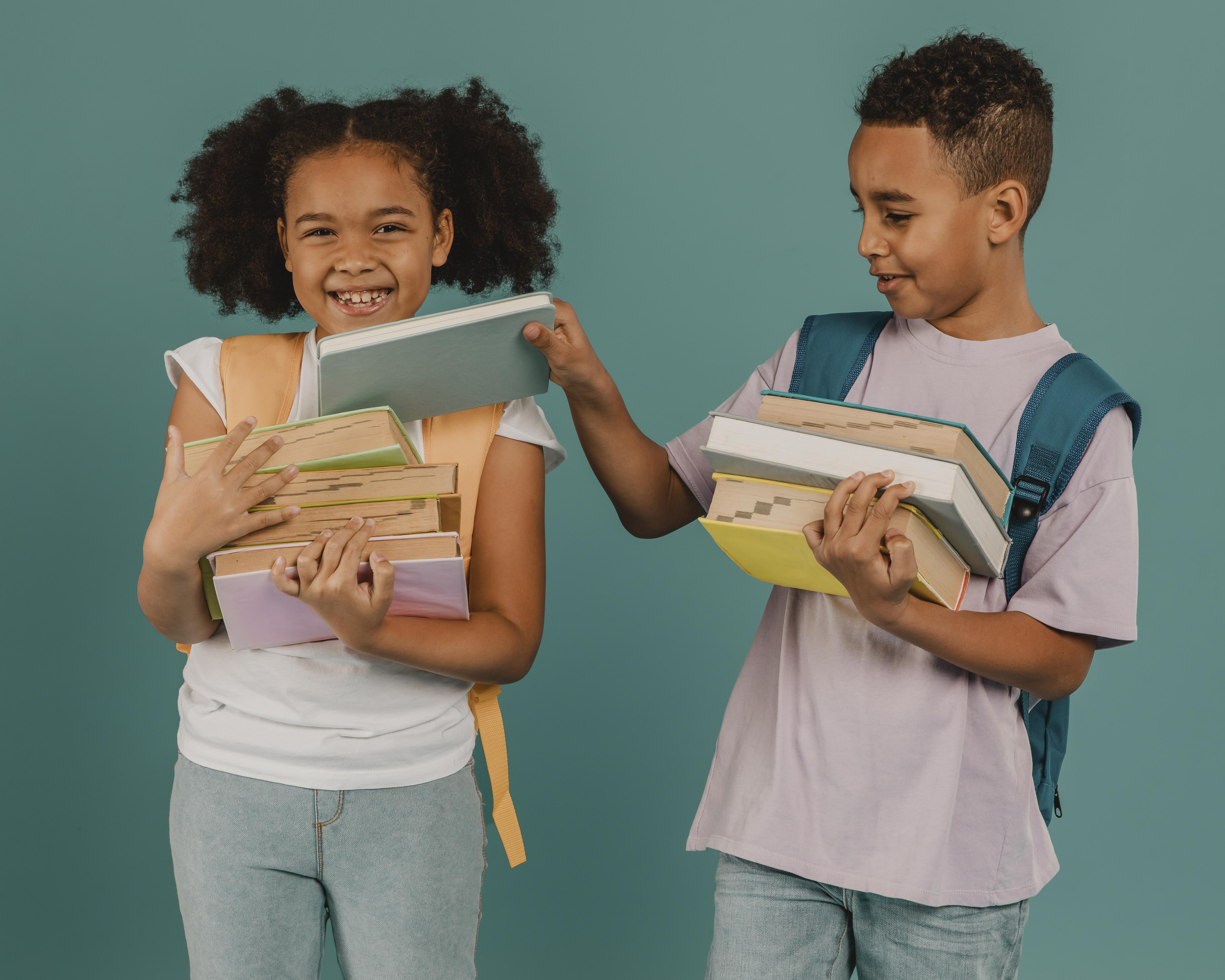 boy helping his friend with books 1